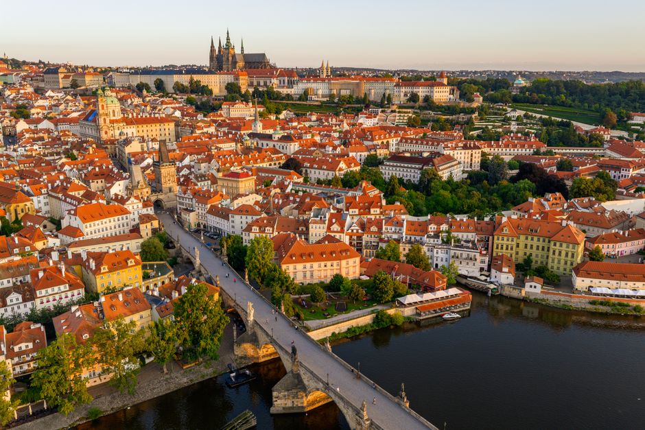 Stunning aerial image of Prague's historic architecture including Charles Bridge and Prague Castle.