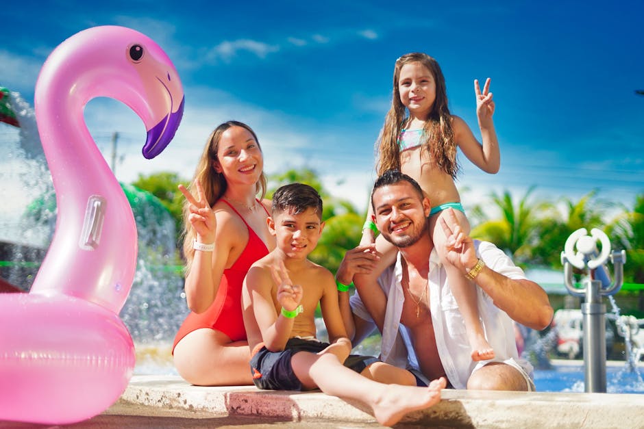 Family enjoying a sunny day by the pool with a pink flamingo float, creating joyful memories.