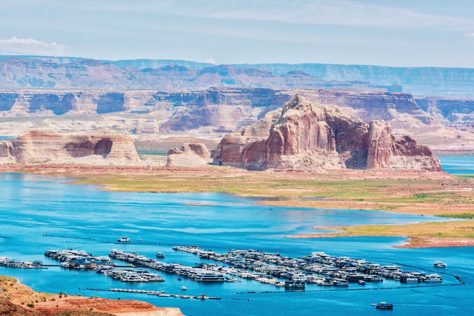 Aerial view of the stunning Lake Powell with boats and dramatic canyons in Arizona.