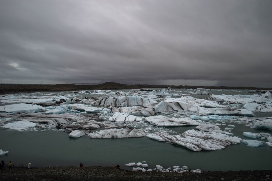 Dramatic icy landscape of Jökulsárlón Glacier Lagoon in Iceland under a cinematic sky.